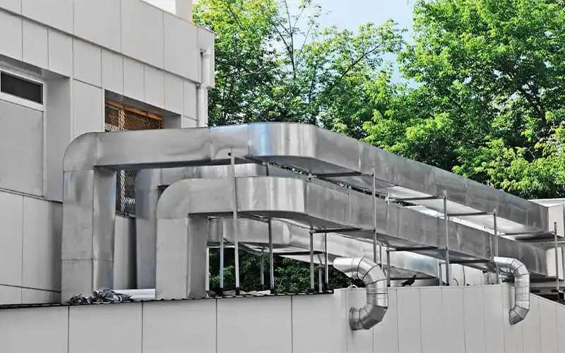 HVAC systems containing high flow box air filters outside of a building.